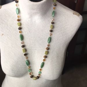 Beaded necklace in shades of green, brown. amber.